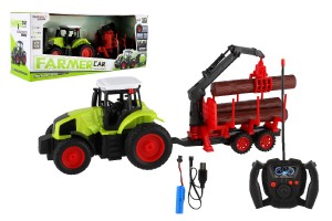 Traktor RC s vlekom na drevo plast 38cm 27MHz + dobjac pack na batrie v krabici 45x18x13cm